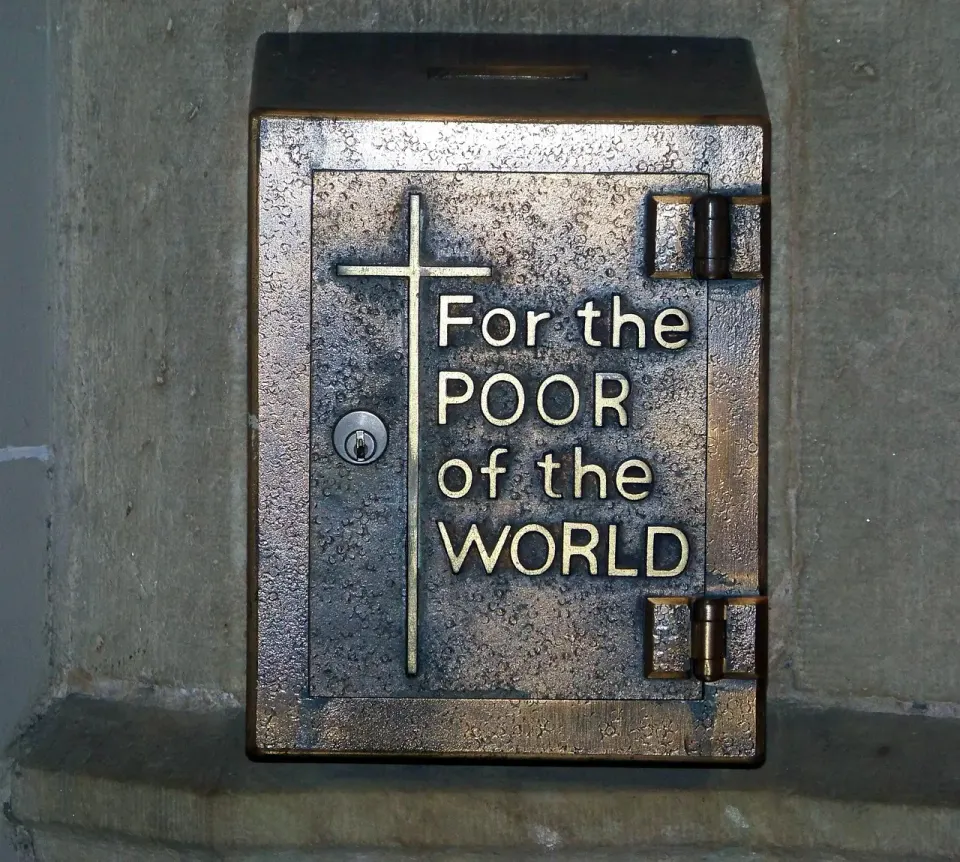 Wooden charity donation box with a coin slot