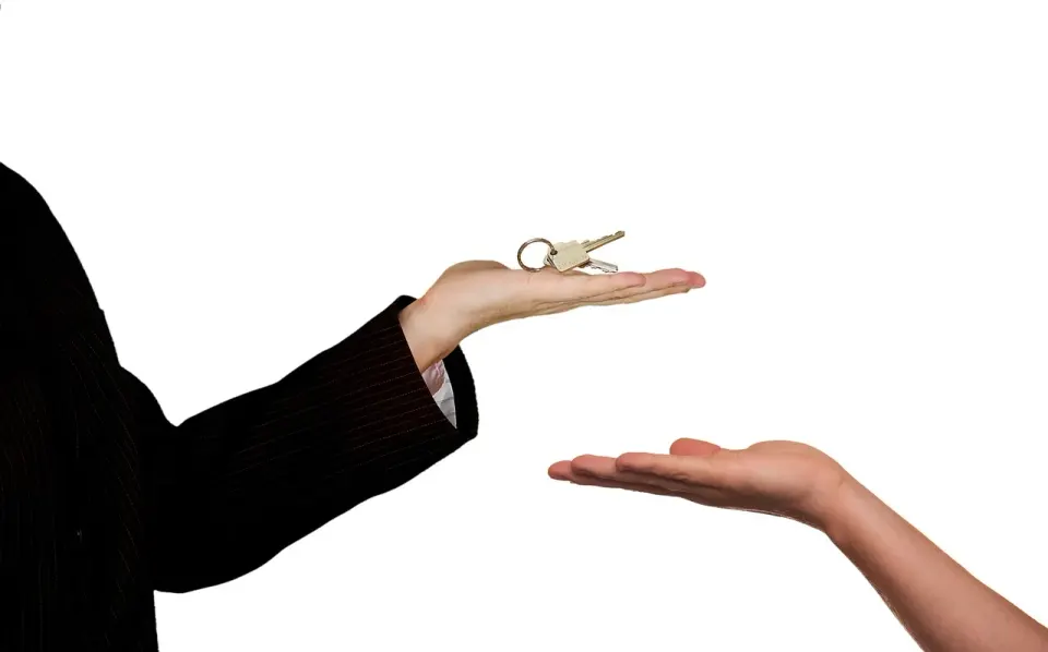 Real estate agent showing a house for sale to buyers