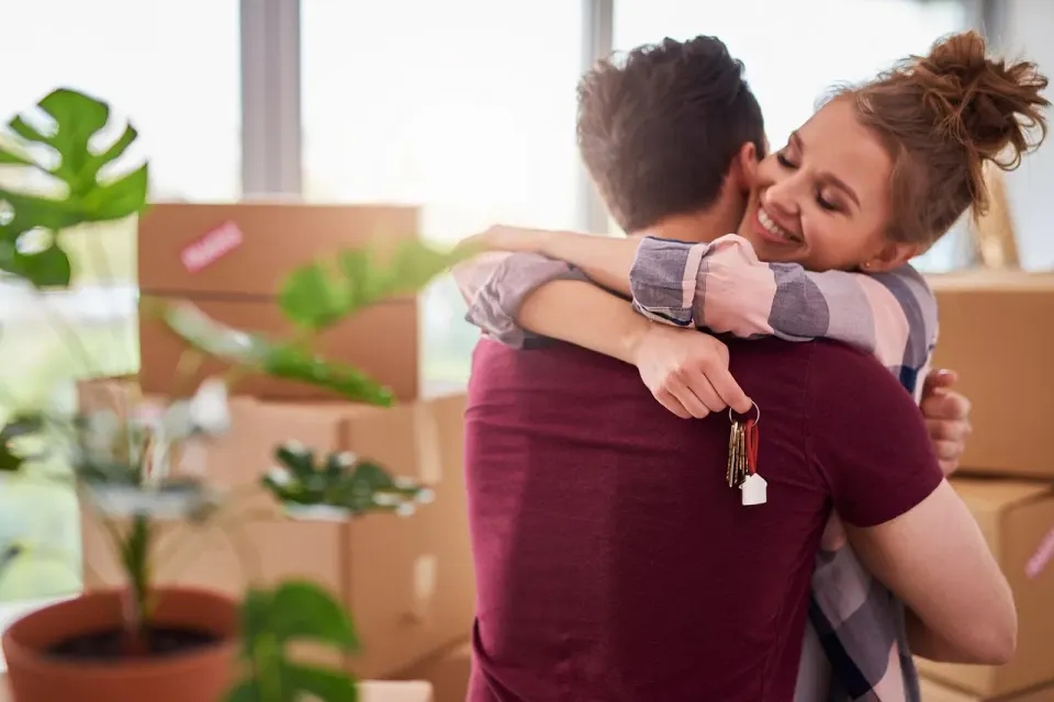 A couple holding the keys to their new home