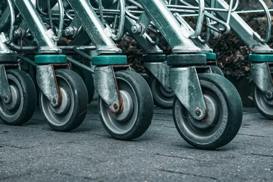 A row of shopping carts outside a supermarket