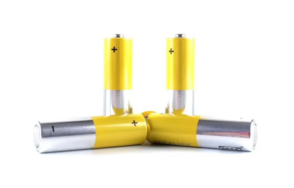 A close-up of small household batteries